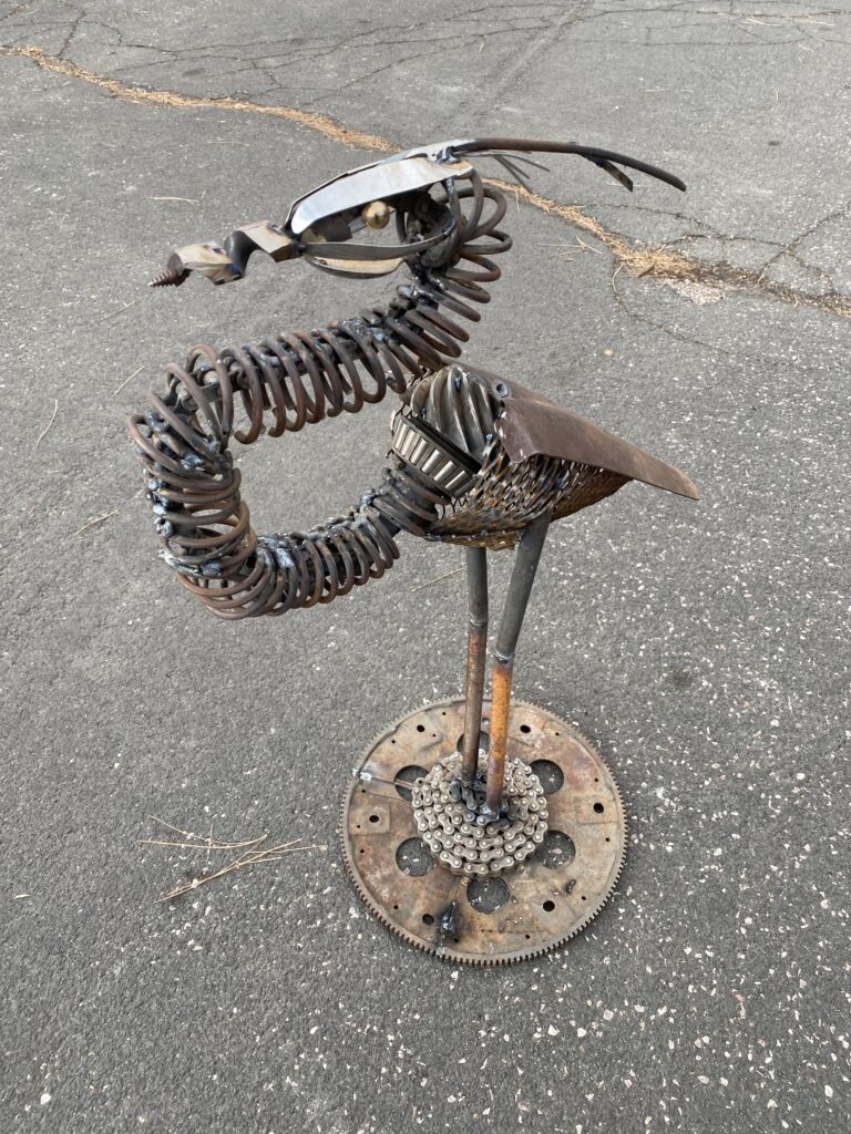 Crane sculpture made out of upcycled junk.